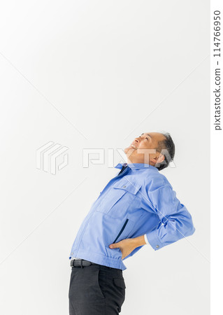 Man in work clothes, back pain, stretching 114766950