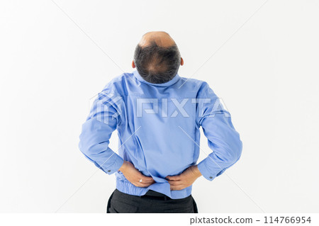 Man in work clothes, back pain, stretching, back view 114766954