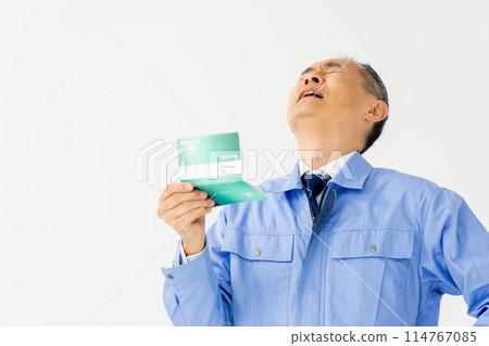 Man in work clothes, bankbook, worries 114767085