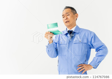 Man in work clothes, bankbook, worries 114767086