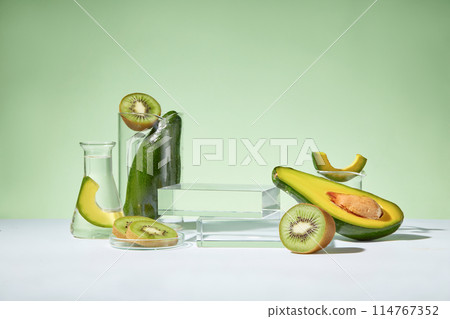 Organic fruit concept with avocados and kiwis decorated with a stack of two rectangle podiums. Natural medicine, cosmetic research, bio science, organic skin care products 114767352