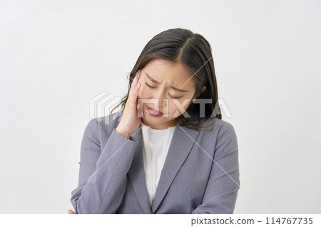 Tired young business woman, white background 114767735