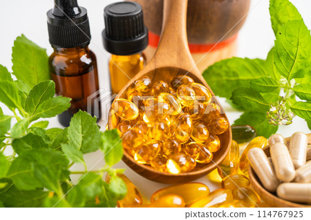 Alternative medicine herbal organic capsule with vitamin E omega 3 fish oil, mineral, drug with herbs leaf natural supplements for healthy good life. 114767925