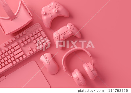 Modern home office setup featuring keyboard, gaming controllers and mouse 114768556