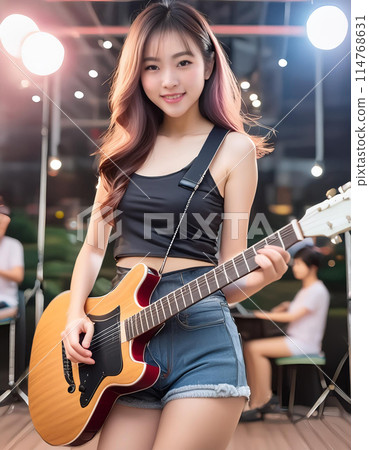 girl playing guitar 114768631
