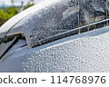Wash your car by spraying foam with a pressure-type foam gun 114768976