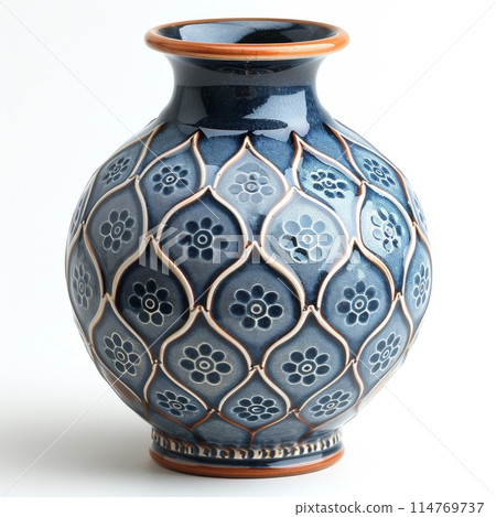 Embossed Blue Ceramic Vase with Floral Design on White Background Embossed Blue Ceramic Vase with Floral Design on White Background 114769737