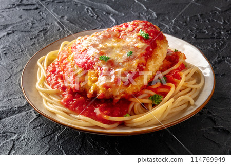 Chicken Parmesan, Italian pasta dish. Breaded chicken breast with cheese 114769949