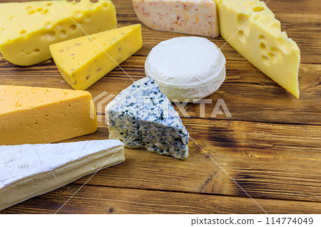 Set of various types of cheese on wooden table 114774049