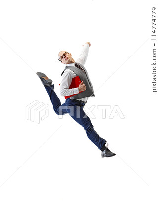 Young man dressed formal outfit and leaping in motion holding red folder against white studio background. 114774779