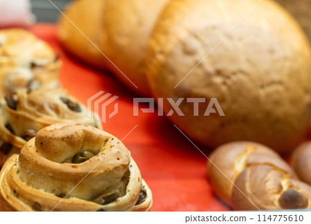 Fresh bread from cereals with seeds in a a bakery. Fresh bread from cereals with seeds in a a bakery. 114775610