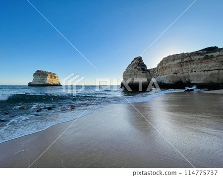 Beautiful seascape with beach, cliffs and ocean. Ferragudo, Portugal 114775737