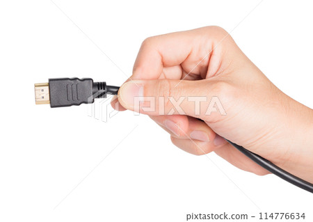 closeup hand holding HDMI plug closeup hand holding HDMI plug 114776634