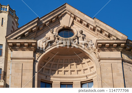 Latvian tourist landmark attraction - old ancient Latvian radio building. Details of antique ornate fasade. Riga city, Latvia. Latvian tourist landmark attraction - old ancient Latvian radio building. Details of antique ornate fasade. Riga city, Latvia. 114777706