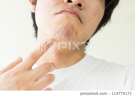 Image of a man concerned about his dark beard 114778171