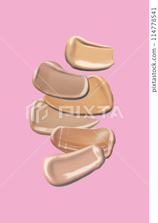 A few swatches foundation smudge texture isolated on a pink background A few swatches foundation smudge texture isolated on a pink background 114778541