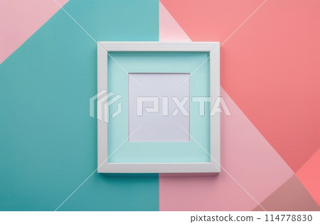White Frame Hanging on Pink and Blue Wall 114778830