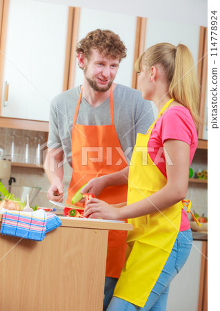 Couple preparing fresh vegetables salad. Diet Couple preparing fresh vegetables salad. Diet 114778924