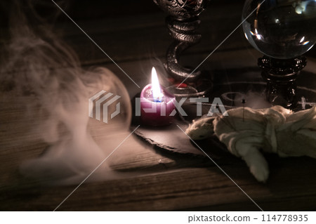 Mysterious Occult Ritual Setup with Crystal Ball and Candles. Mysterious Occult Ritual Setup with Crystal Ball and Candles. 114778935