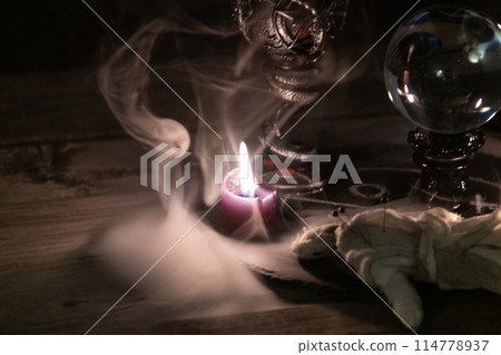Mysterious Occult Ritual Setup with Crystal Ball and Candles. Mysterious Occult Ritual Setup with Crystal Ball and Candles. 114778937