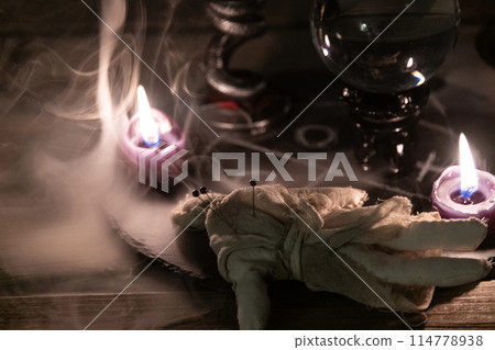 Enigmatic Occult Ritual with Chalice and Crystal Ball. 114778938