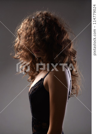 Beautiful Woman with curly Hair. Hairy Female silhouette 114779024