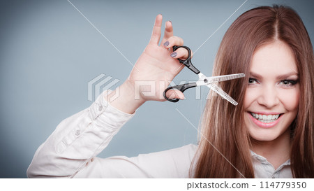 Crazy girl with scissors. Hairdresser in action. Crazy girl with scissors. Hairdresser in action. 114779350