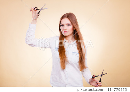 Smiling lady showing tools. 114779353