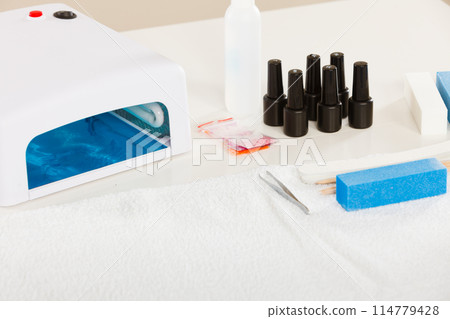 Professional gel hybrid manicure set at beautician salon 114779428