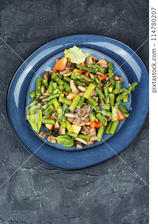 Vegan green asparagus and mushroom salad. 114780207