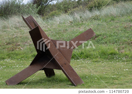Normandy France D-Day soldiers sculptures and hedgehogs near WWII Utah Beach. Veterans Day rememberance. High quality photomontage Normandy France D-Day soldiers sculptures and hedgehogs near WWII Utah Beach. Veterans Day rememberance. High quality photomontage 114780720