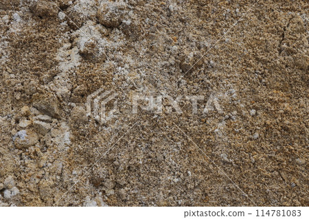 Surface structure of river sand. Large river sand at a construction site. Surface structure of river sand. Large river sand at a construction site. 114781083