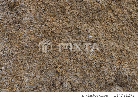 Surface structure of river sand. Large river sand at a construction site. Surface structure of river sand. Large river sand at a construction site. 114781272