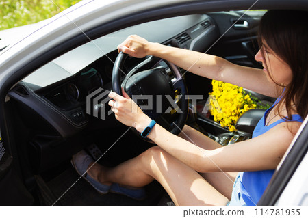 Young girl driving a car, handing over the right to drive a car. Young girl driving a car, handing over the right to drive a car. 114781955