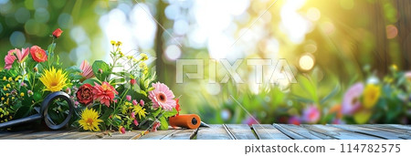Wooden table covered with an array of vibrant flowers and garden tools against a blurred natural backdrop. Generative AI 114782575