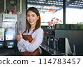 Startup new business, Business owner concept. Portrait of Asian young woman working in coffee shop 114783457