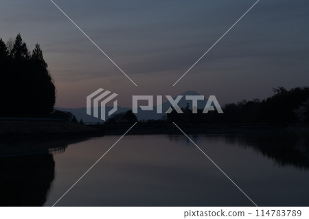 Dawn sky and Mt. Fuji reflected in an irrigation pond Dawn sky and Mt. Fuji reflected in an irrigation pond 114783789