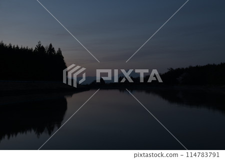 Dawn sky and Mt. Fuji reflected in an irrigation pond Dawn sky and Mt. Fuji reflected in an irrigation pond 114783791