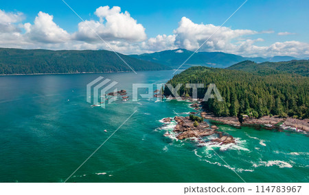Aerial View of the West Coast of Pacific Ocean. Sunny Cloudy Day. Aerial View of the West Coast of Pacific Ocean. Sunny Cloudy Day. 114783967