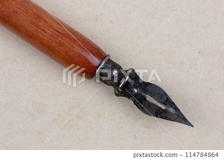 Fountain pen on an antique textured paper. Fountain pen on an antique textured paper. 114784864