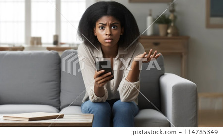 Dismayed young black woman 114785349