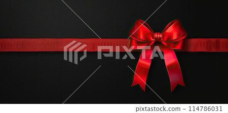 Black background accentuates the magenta ribbon with a bow 114786031