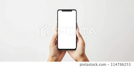 Hand holding cell phone with white screen, a portable communication device Hand holding cell phone with white screen, a portable communication device 114786253