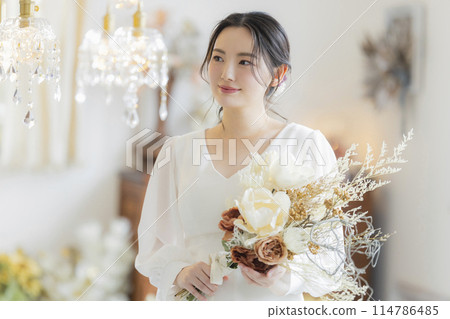 Young woman in a wedding dress Young woman in a wedding dress 114786485
