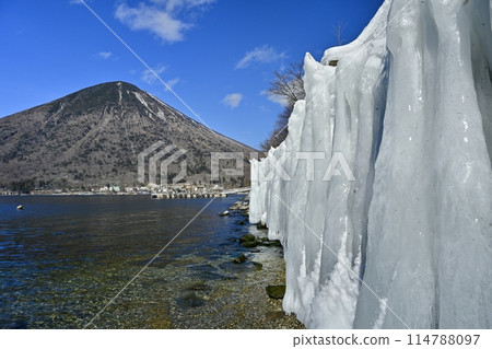 Mt. Nantai on the ice wall at Utagahama Beach on the east shore of Lake Chuzenji Mt. Nantai on the ice wall at Utagahama Beach on the east shore of Lake Chuzenji 114788097