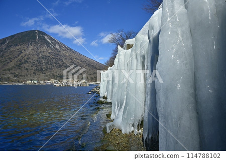 Mt. Nantai on the ice wall at Utagahama Beach on the east shore of Lake Chuzenji 114788102