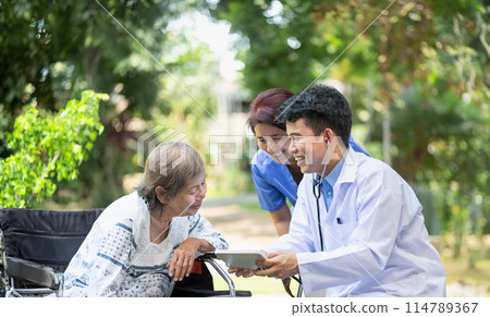 Doctor checking health of elderly woman during homecare medical. Doctor checking health of elderly woman during homecare medical. 114789367