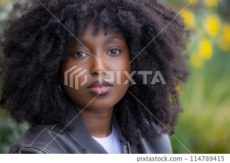 Portrait of a Black Woman with Natural Hair in Outdoor Setting Portrait of a Black Woman with Natural Hair in Outdoor Setting 114789415