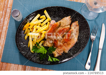 Delicious Chinese food, pig's feet with potatoes on side 114789513