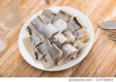 Fillet of appetizing herring 114789693